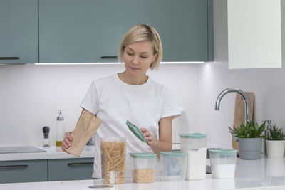 Portrait of young woman working at home