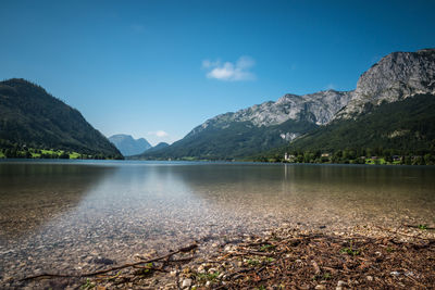 Scenic view of lake and mountains against sky