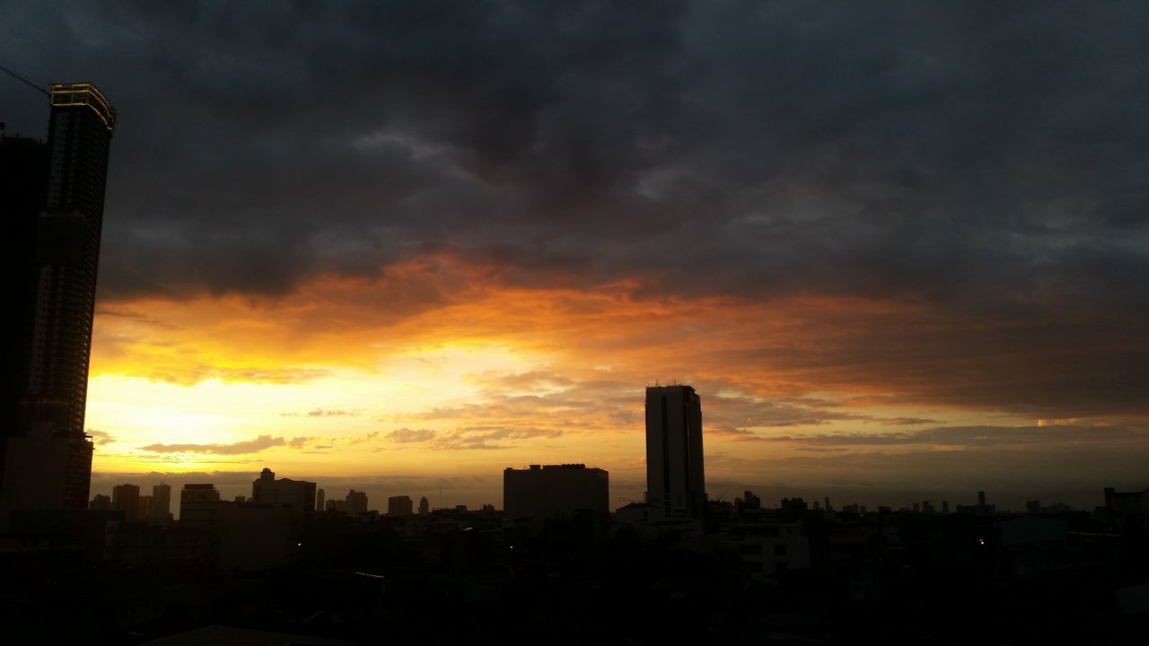 architecture, building exterior, sunset, built structure, city, sky, silhouette, skyscraper, cloud - sky, cityscape, orange color, tower, urban skyline, tall - high, cloudy, modern, dramatic sky, office building, building, city life