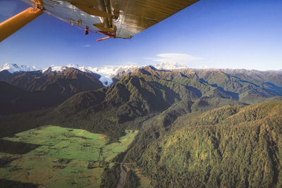 Scenic view of landscape and mountains against sky