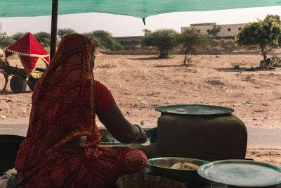 Rear view of woman working