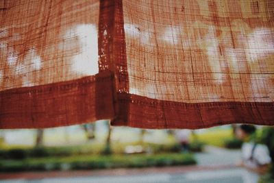 Close-up of red cloth on white surface