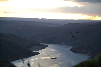 Scenic view of landscape against sky during sunset