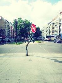 City street against cloudy sky