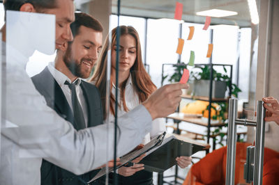 Portrait of female doctor examining patient in laboratory