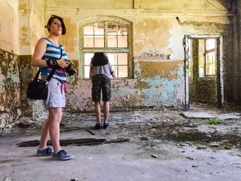 Full length of woman standing in building