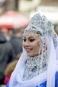 Close-up portrait of a smiling young woman