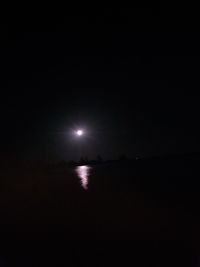 Scenic view of sea against sky at night