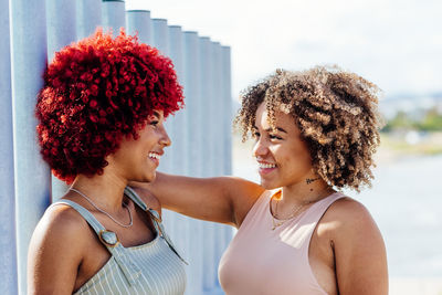 Two latin with afro hair in a carefree attitude.