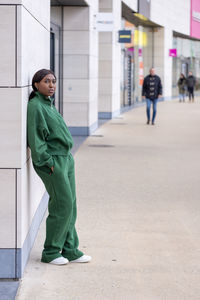 Portrait of young man walking on street