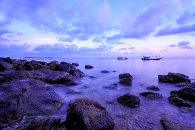 Scenic view of sea against sky at sunset