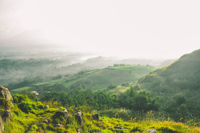 Scenic view of landscape and mountains against sky