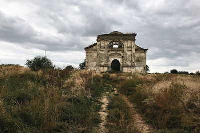 View of castle against cloudy sky