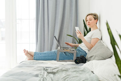 Young woman using laptop at home