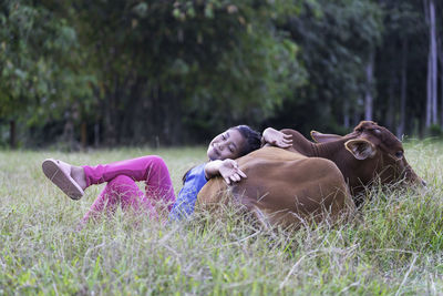 High angle view of woman relaxing on field