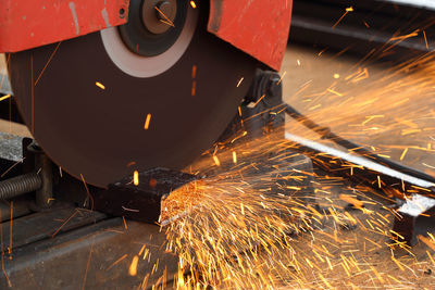 Low angle view of illuminated machinery