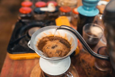 Hot water from the kettle to pour the coffee.