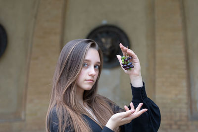 Portrait of a young woman with arms hair