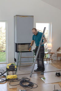 Man installing fireplace