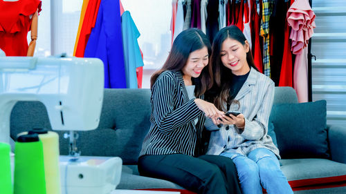 Friends sitting on mobile phone