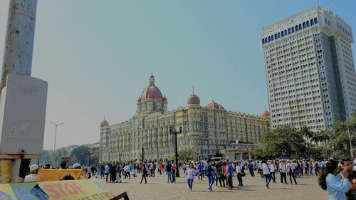 Group of people in front of buildings