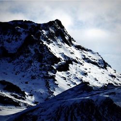 Scenic view of snow mountains against sky