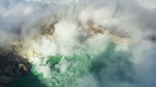 Aerial view of smoke emitting from acid lake