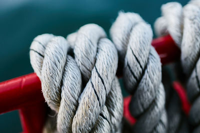 High angle view of rope on railing