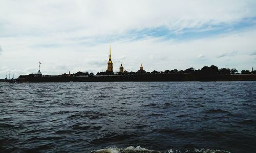 View of calm sea against cloudy sky