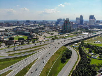 High angle view of street amidst buildings against sky