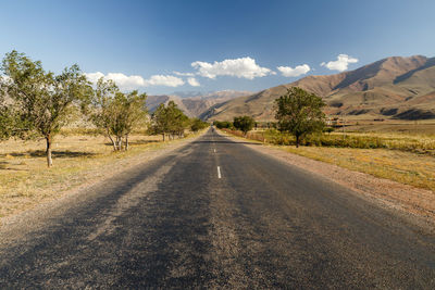 Asphalt road, entrance to the boom gorge, kyrgyzstan.