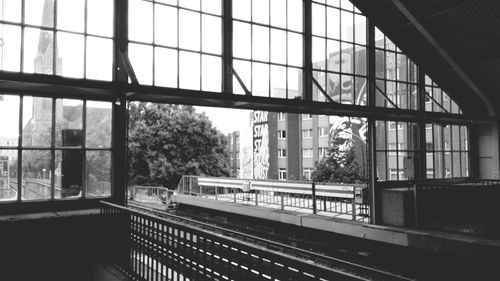 Railroad station platform seen through window