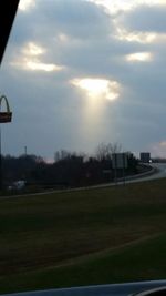 View of road against cloudy sky