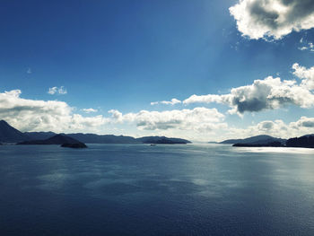 Scenic view of sea against blue sky