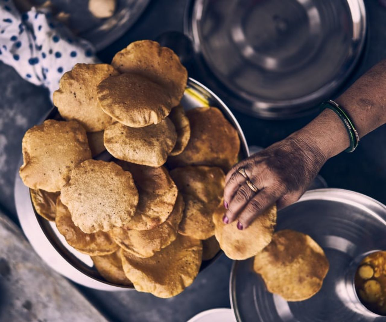 food, food and drink, hand, freshness, one person, baked, adult, dish, preparing food, holding, healthy eating, vegetable, bread, produce, lifestyles, bowl, sweet food, indoors, snack, wellbeing, men, spice, occupation