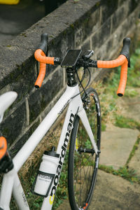 Close-up of bicycle parked on field