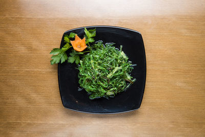 High angle view of vegetables in plate on table