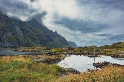 Scenic view of lake and mountains against sky