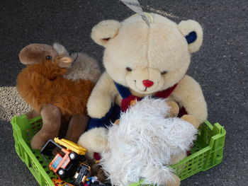 Close-up of stuffed toys on road