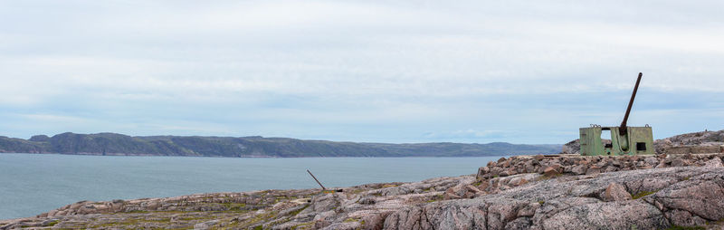 Scenic view of sea and buildings against sky