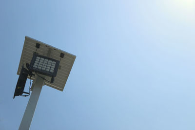 Low angle view of street light against clear blue sky