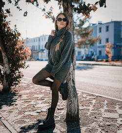 Portrait of young woman in city