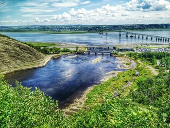 High angle view of river against cloudy sky