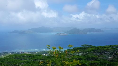 View of calm sea against mountain range
