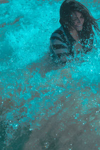 Woman swimming in pool