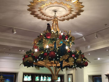 Low angle view of chandelier hanging from ceiling