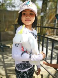 Portrait of girl standing outdoors