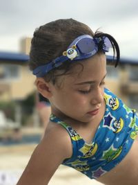 Cute girl wearing swimwear on poolside