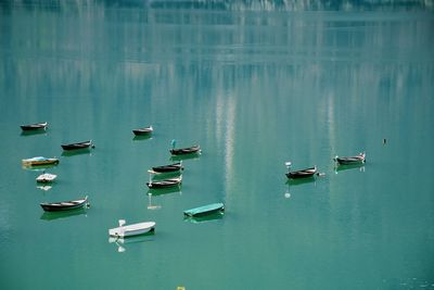 Moored boats in calm lake