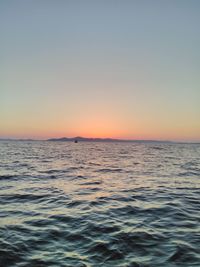 Scenic view of sea against sky at dusk